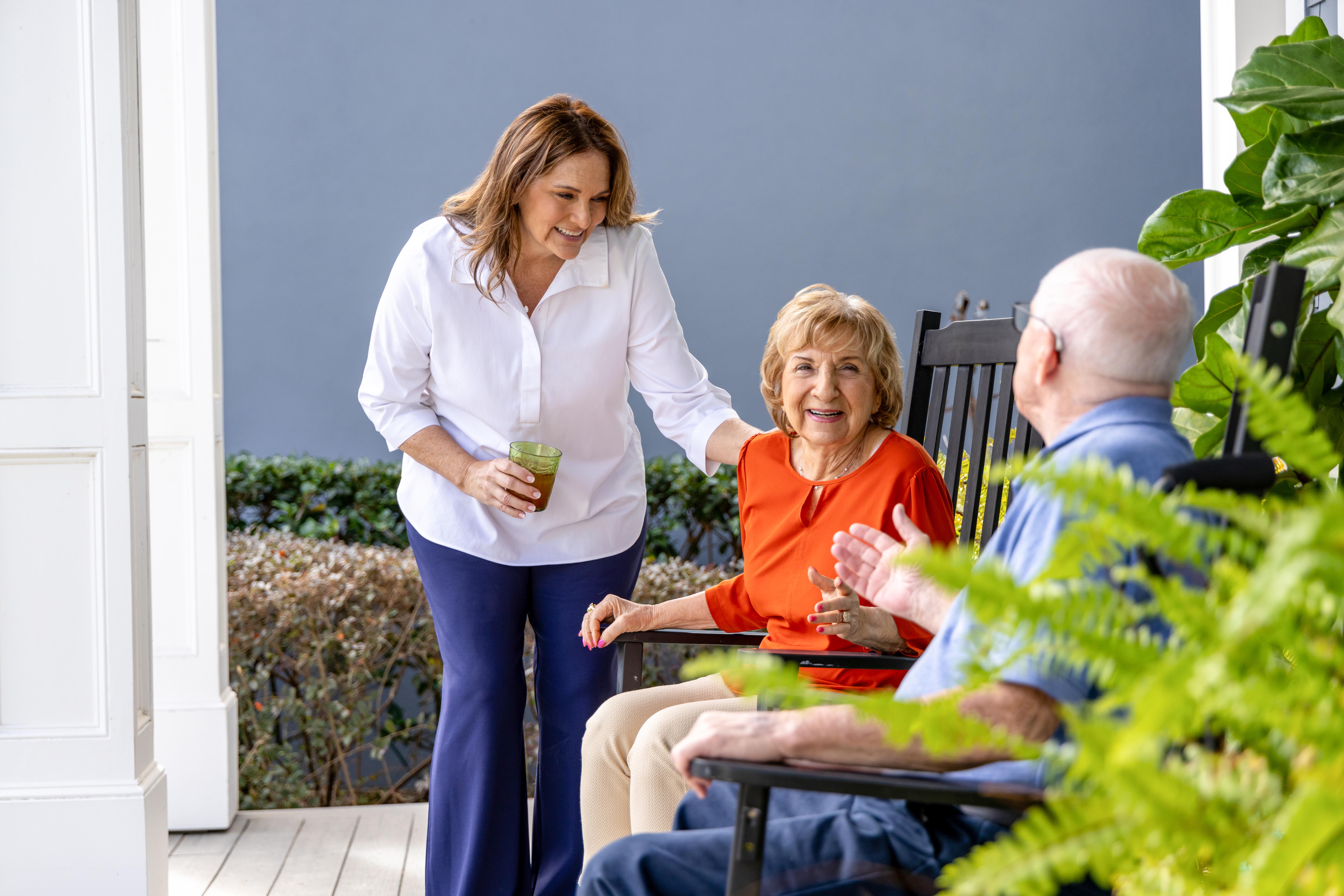 Adult daughter supporting senior parent at home with compassion