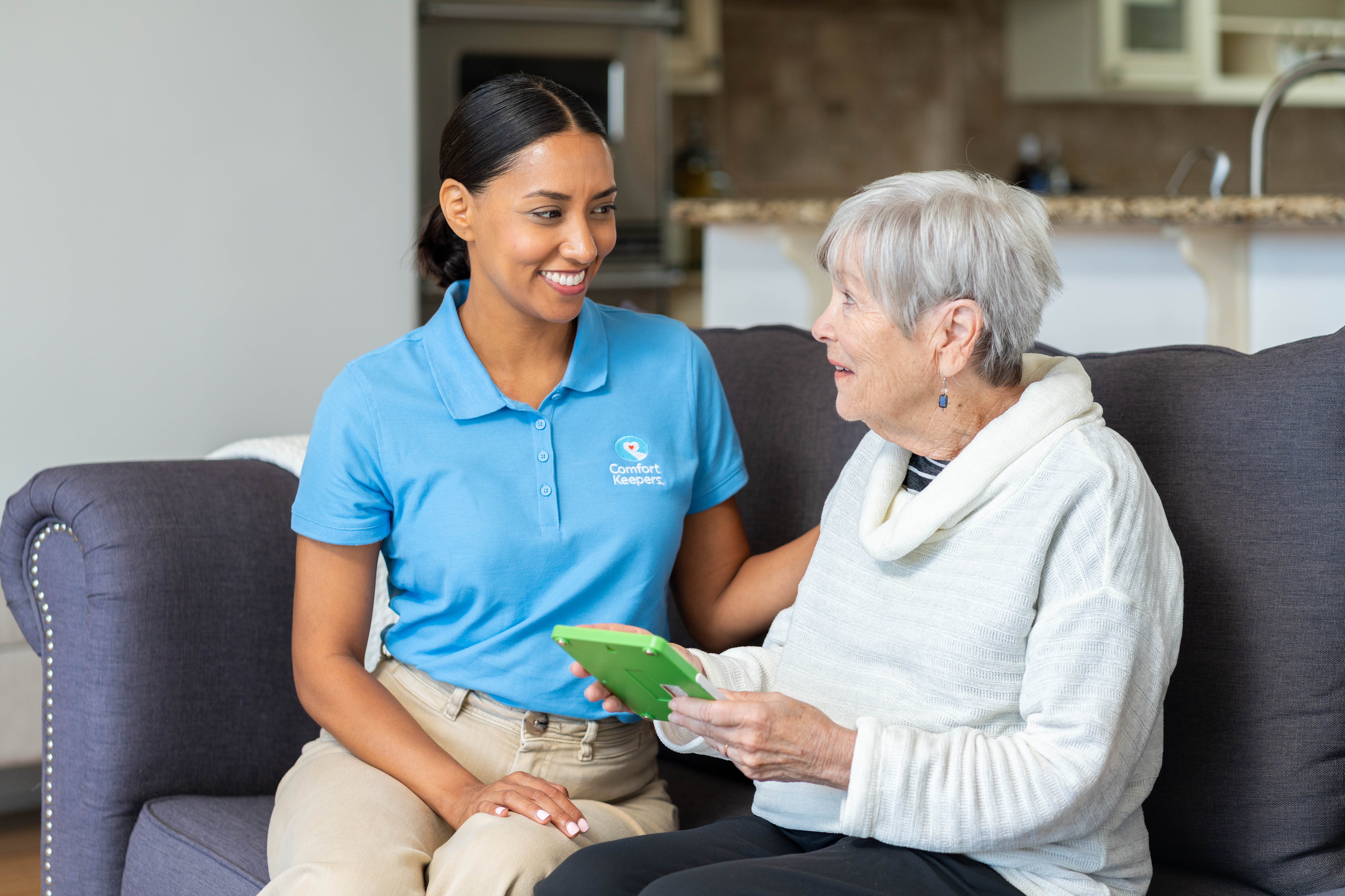 Caregiver spending quality time with senior at home