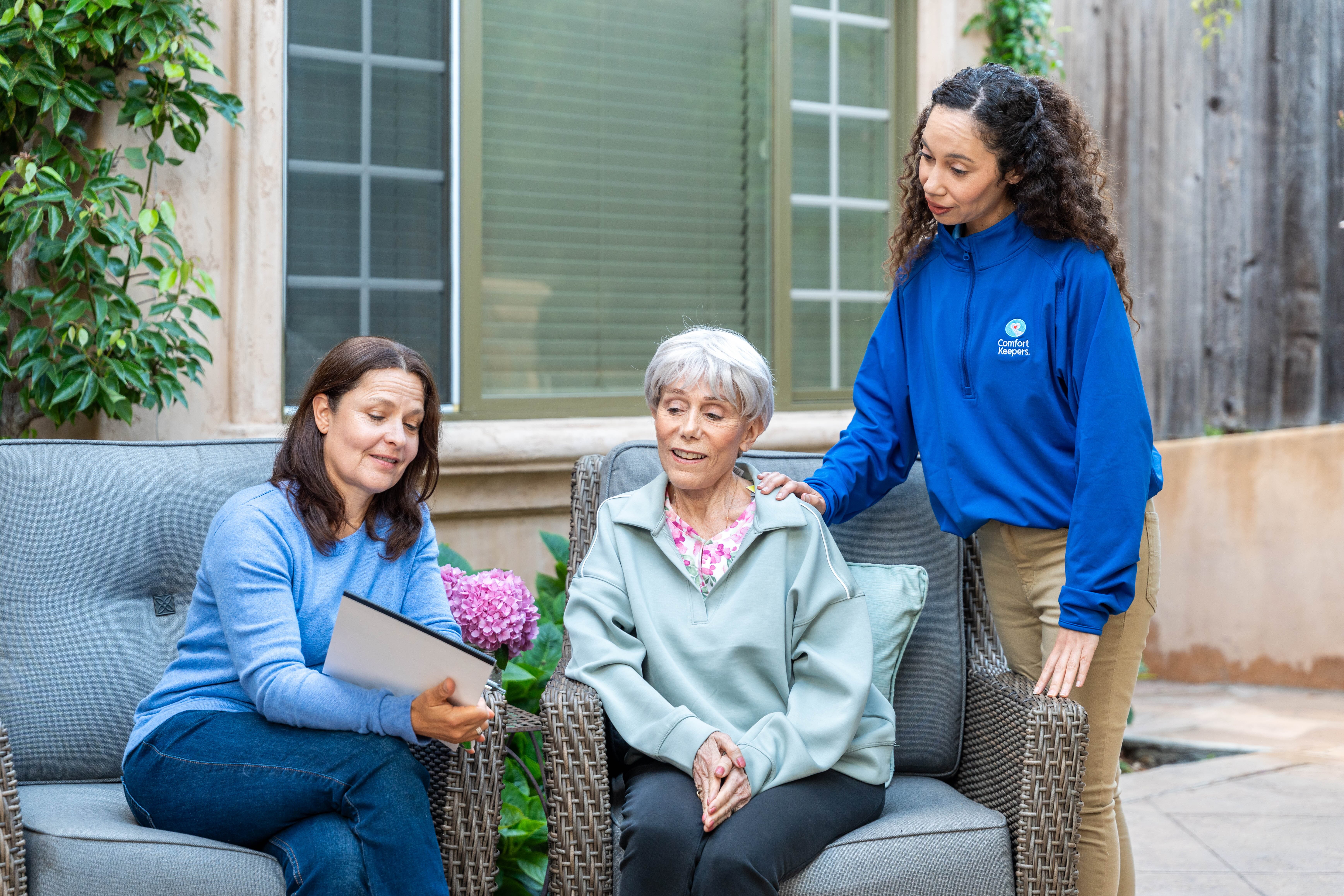 Caregiver helping senior with mobility and safety at home